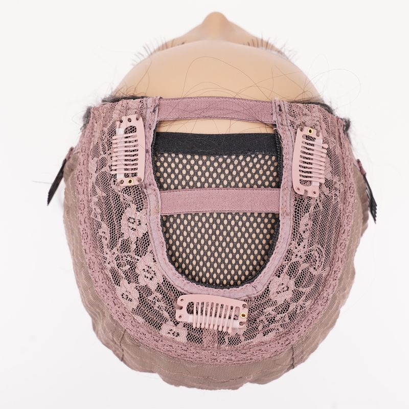 A close-up look at the interior of the light brown U-part cap from hairdiamondz's Brazilian Body Wave U-Part Wig reveals intricate lace and mesh details. Three pink clips are attached to secure the wig in place, with the perspective showcasing its construction from above.