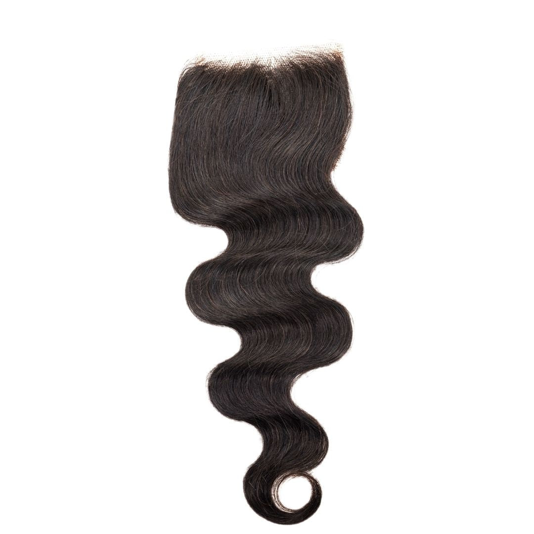 On a white background, the hairdiamondz Brazilian Body Wave Closure is displayed. This virgin hairpiece features a sleek and shiny texture with loose, flowing waves that gently spiral at the ends, providing a natural look.