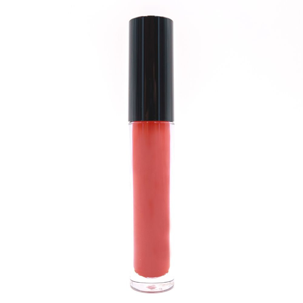 A Shadow Red Matte Lipstick with a glossy black cap stands upright against a plain white background, hinting at its transformation into bold matte lips that last all day.