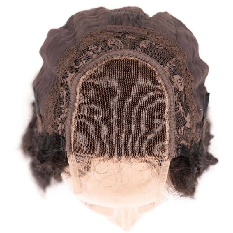 A Kinky Curly Transparent Closure Wig by hairdiamondz, viewed from above, highlights the delicate lace netting at the front and reveals the wig's intricate inner design. The cap features synthetic wavy brown hair, showcasing its exceptional craftsmanship.