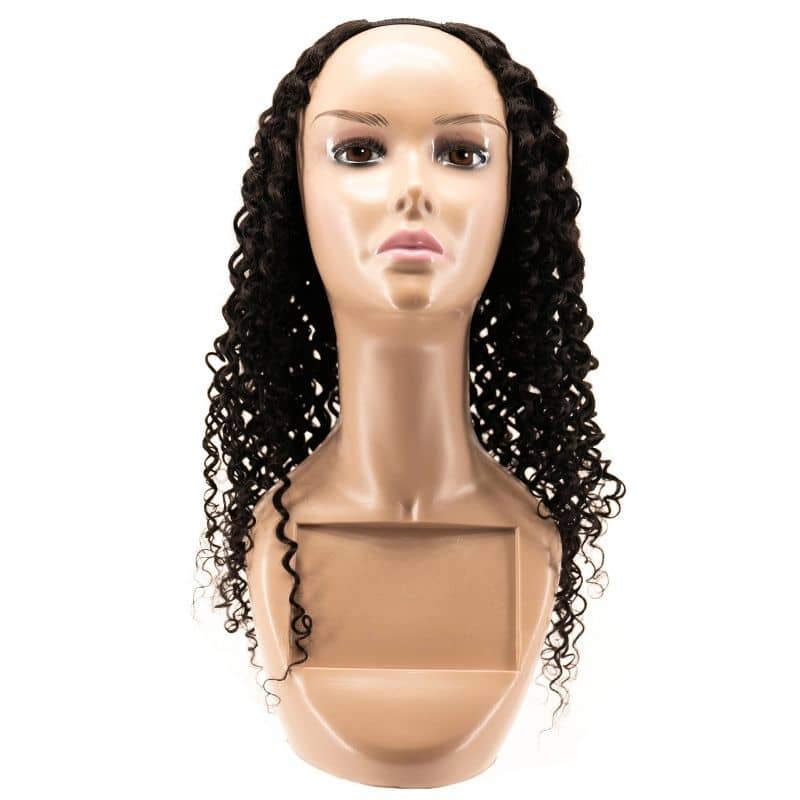 Displayed against a plain background is a mannequin head showcasing the hairdiamondz Brazilian Kinky Curly U-Part Wig, featuring long, curly, dark virgin hair. The loose and flowing curls elegantly cascade over the mannequin's shoulders.