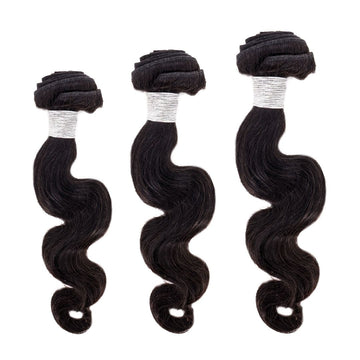 Three bundles of dark, wavy hair extensions are aligned vertically on a white background. The hair has a shiny texture and each bundle is tightly secured with visible silver ties at the top.