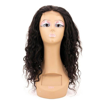 The Messy Curl Transparent Closure Wig by hairdiamondz is showcased, featuring long, wavy Virgin Hair in black with pink eyeshadow and glossy lips, set against a white background.