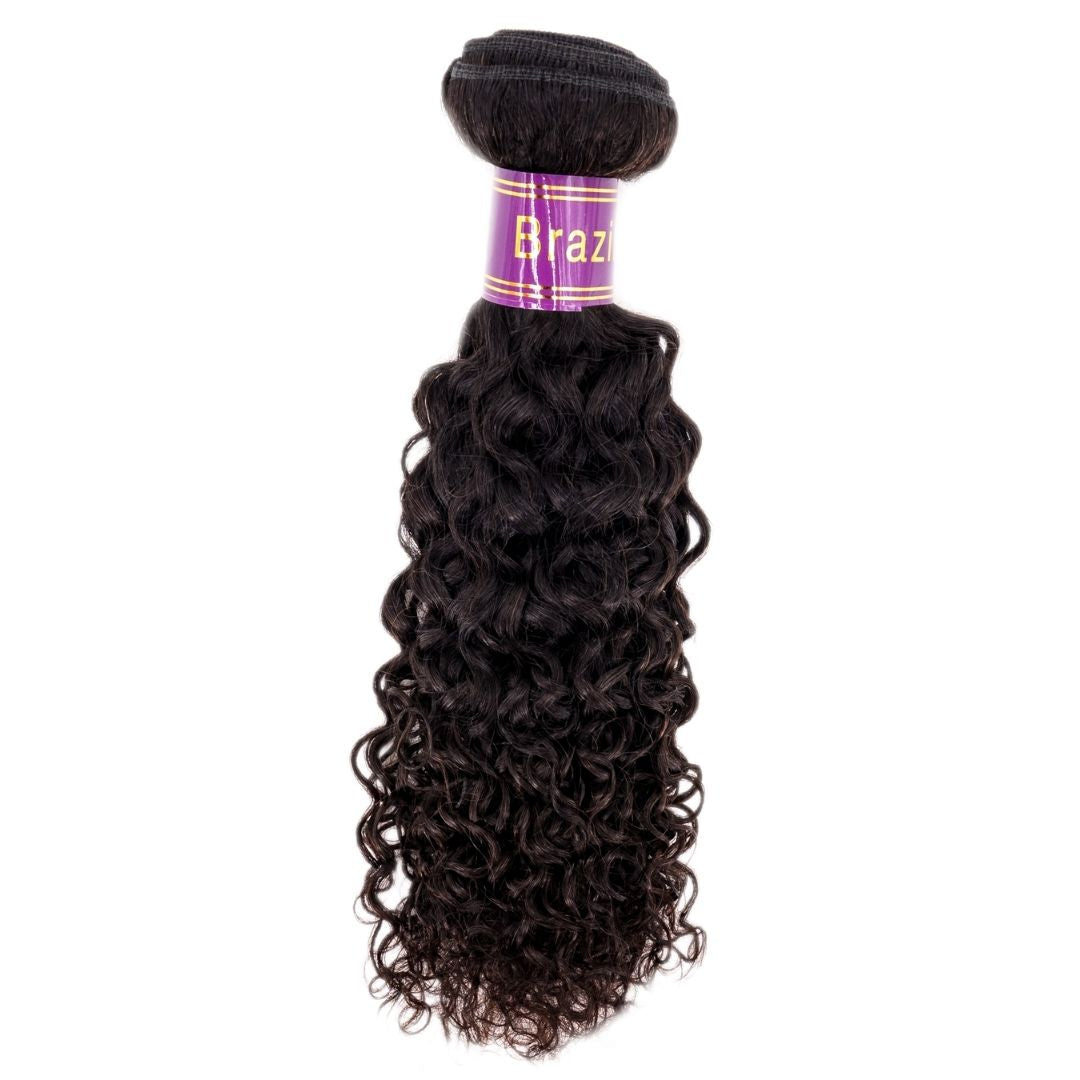 A set of hairdiamondz Virgin Hair extensions, featuring the Brazilian Kinky Curly style, comes with a distinctive purple label wrapped at the top. The hair is characterized by its dark, glossy appearance and tight curls.