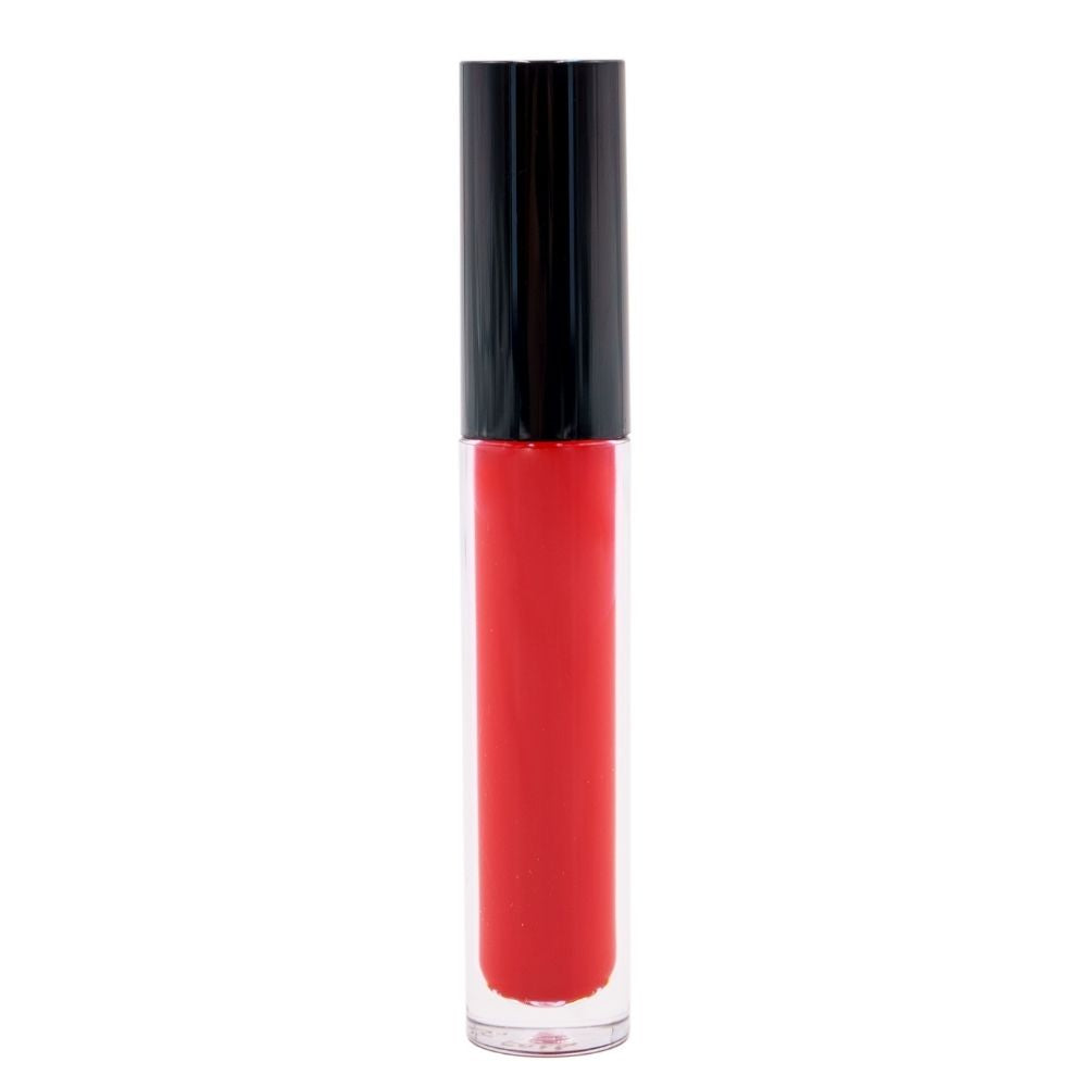 The Jasper Red Matte Lipstick, with a black cap, stands upright on a white background. Its clear tube reveals vibrant red hues enriched with moisturizing elements for a confident look.