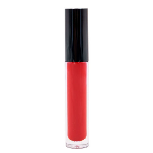 The Jasper Red Matte Lipstick, with a black cap, stands upright on a white background. Its clear tube reveals vibrant red hues enriched with moisturizing elements for a confident look.