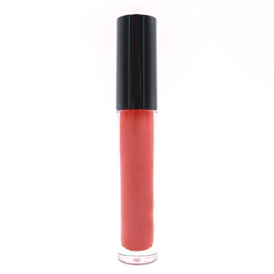 A Shadow Red Matte Lipstick with a glossy black cap stands upright against a plain white background, hinting at its transformation into bold matte lips that last all day.