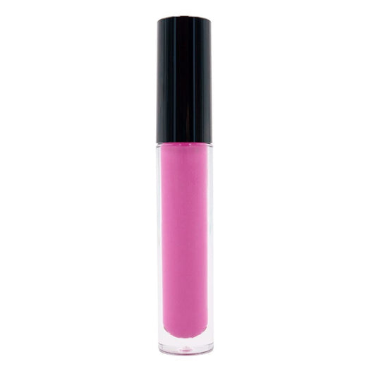 A clear tube of Sky Magenta Matte Lipstick with a striking black cap against a white background suggests the bold matte lip trend while incorporating moisturizing elements for a flawless finish.