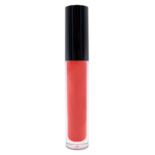 The Strawberry Red Matte Lipstick features a sleek black cap with its rich red shade showcased through a transparent tube. Enhanced with moisturizers, this bold lipstick ensures comfort and a striking look, set against a crisp white background.