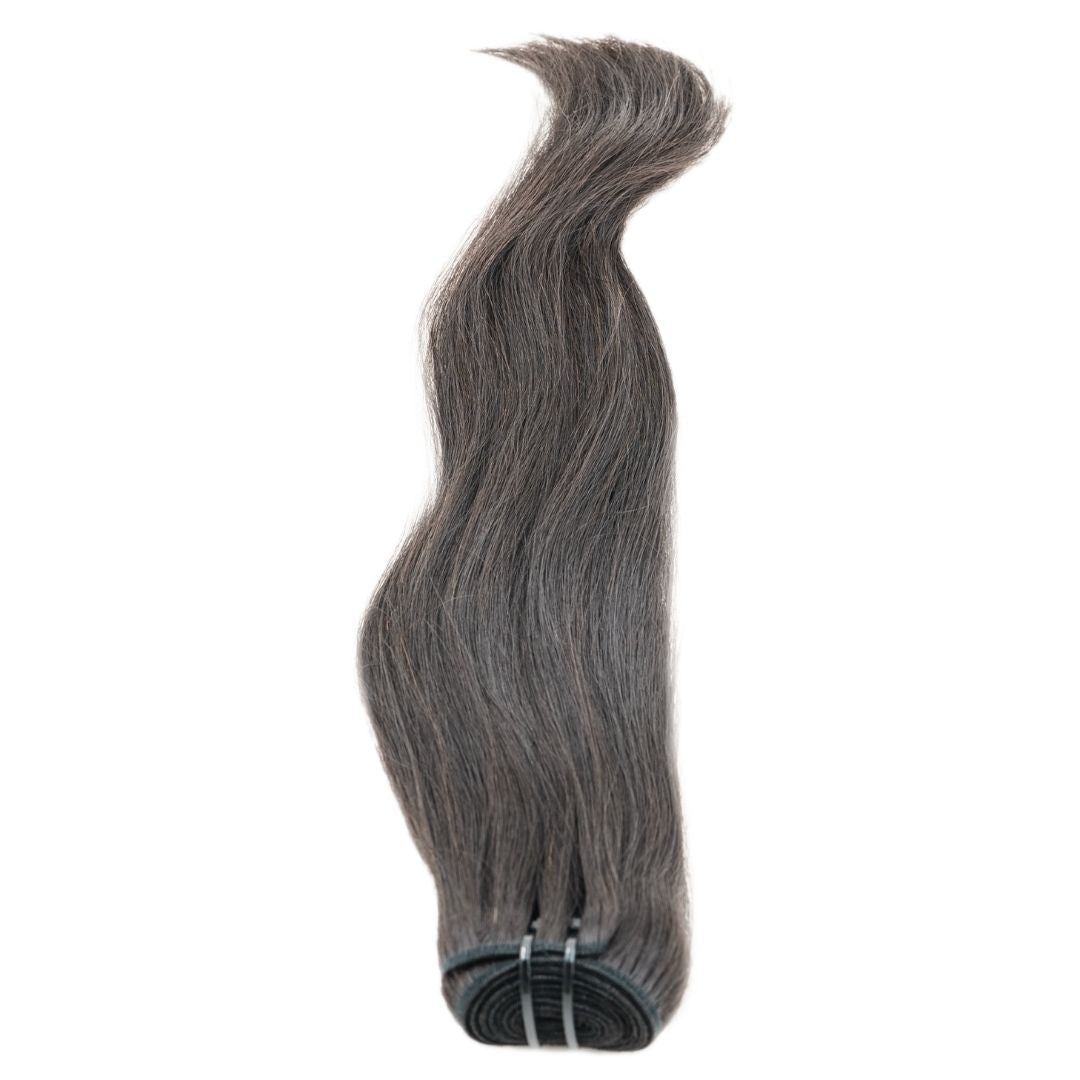 A bundle of hairdiamondz's Vietnamese Straight, featuring premium quality long, wavy, dark brown strands with subtle gray highlights, is secured with an elastic band at the bottom. The thick hair is neatly arranged against a plain white background, showcasing its smooth texture and natural shine.